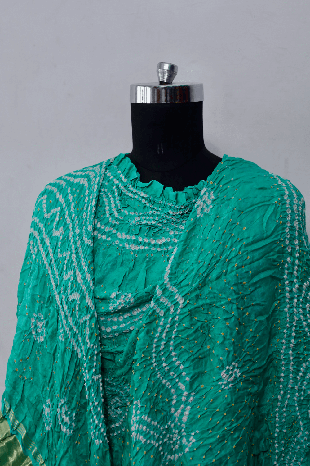 Ethnic aqua mint Gajji silk dupatta showcasing authentic Bandhani artistry
Luxurious aqua mint Bandhani dupatta crafted in soft and lustrous