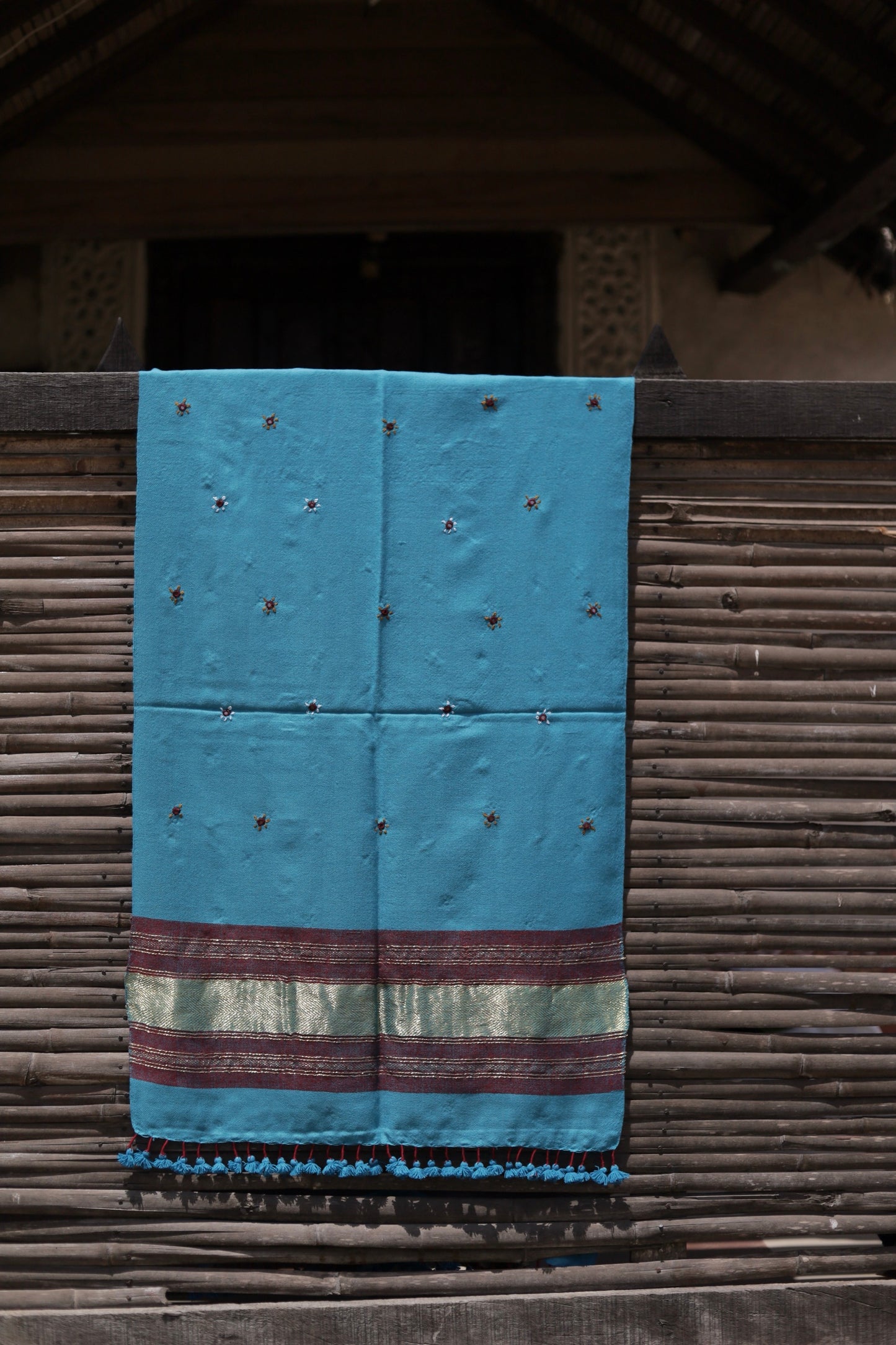 Elegant aqua blue wool stole handcrafted using traditional handloom weaving techniques