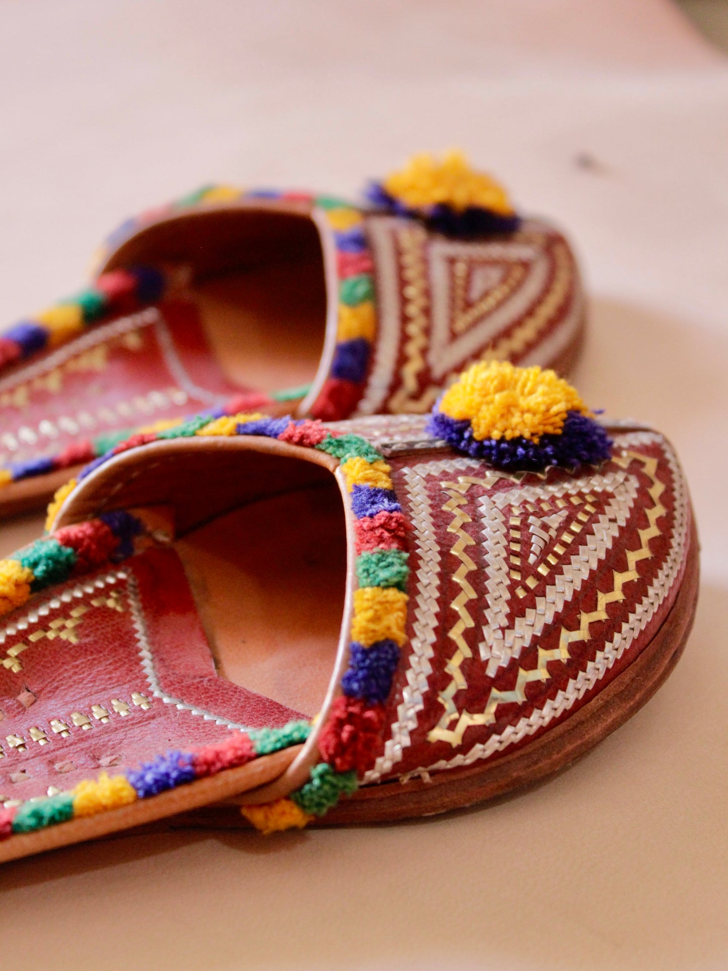 Handstitched leather jutti showcasing traditional artisan craftsmanship and timeless design