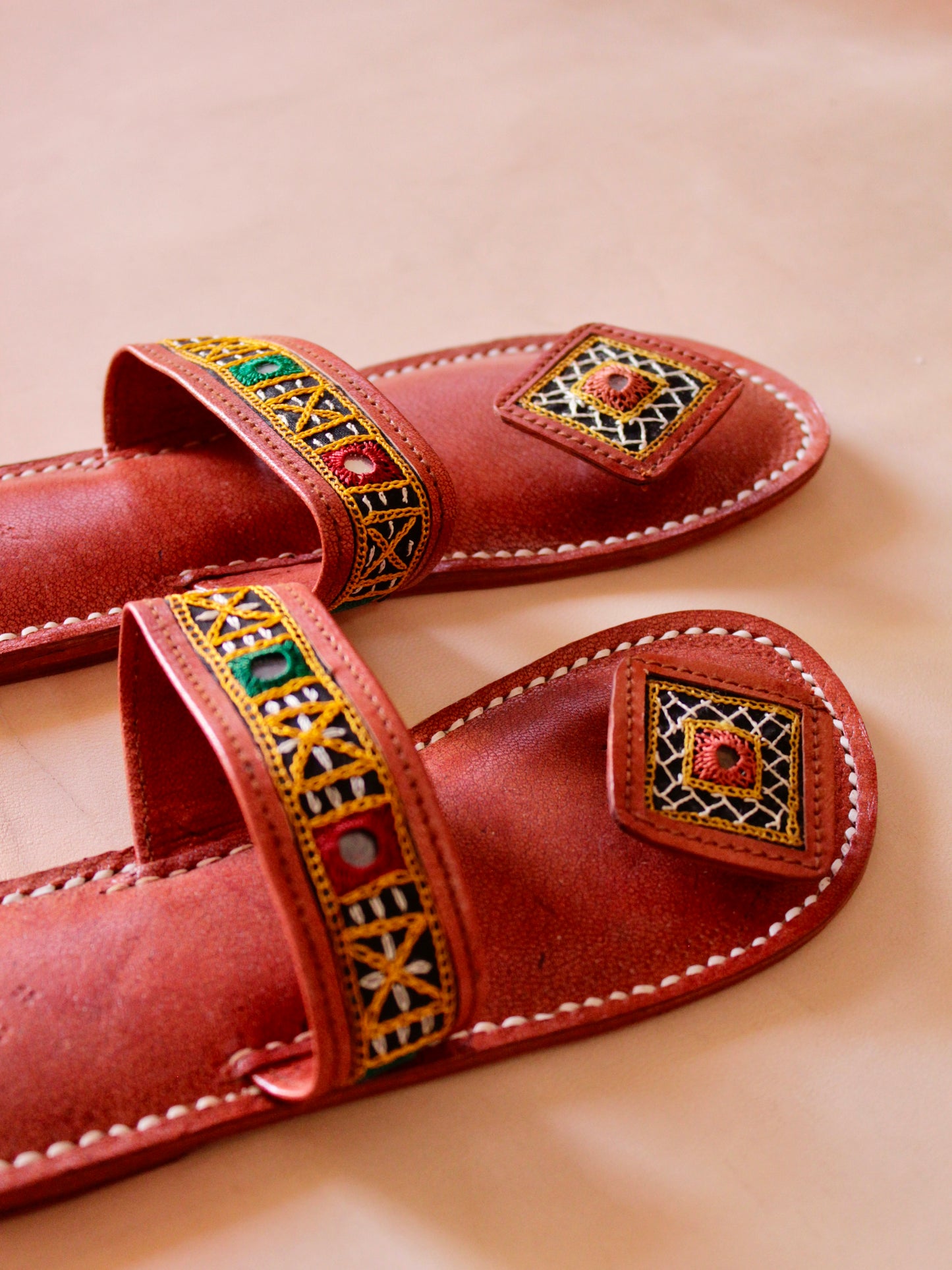 Kutchi embroidery handstitched leather flats showcasing traditional artisan craftsmanship