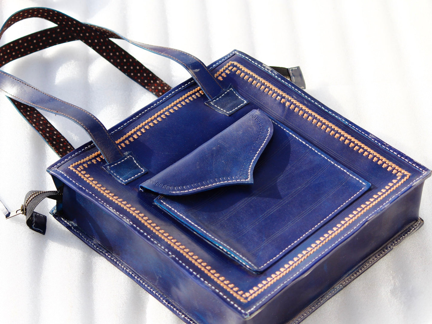 Handstitched leather bag crafted from premium leather with meticulous handmade detailing