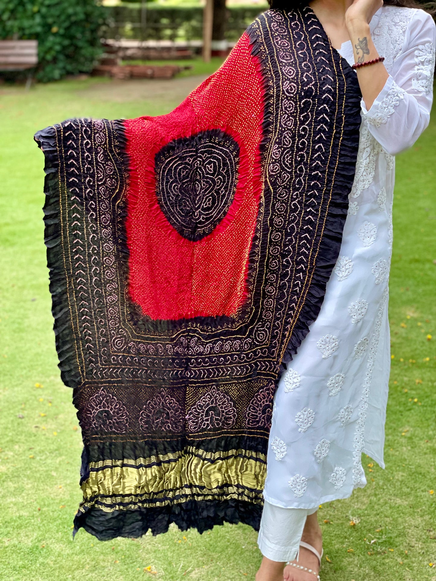 Traditional deep red and black Bandhani Gajji silk dupatta with intricate artisanal patterns