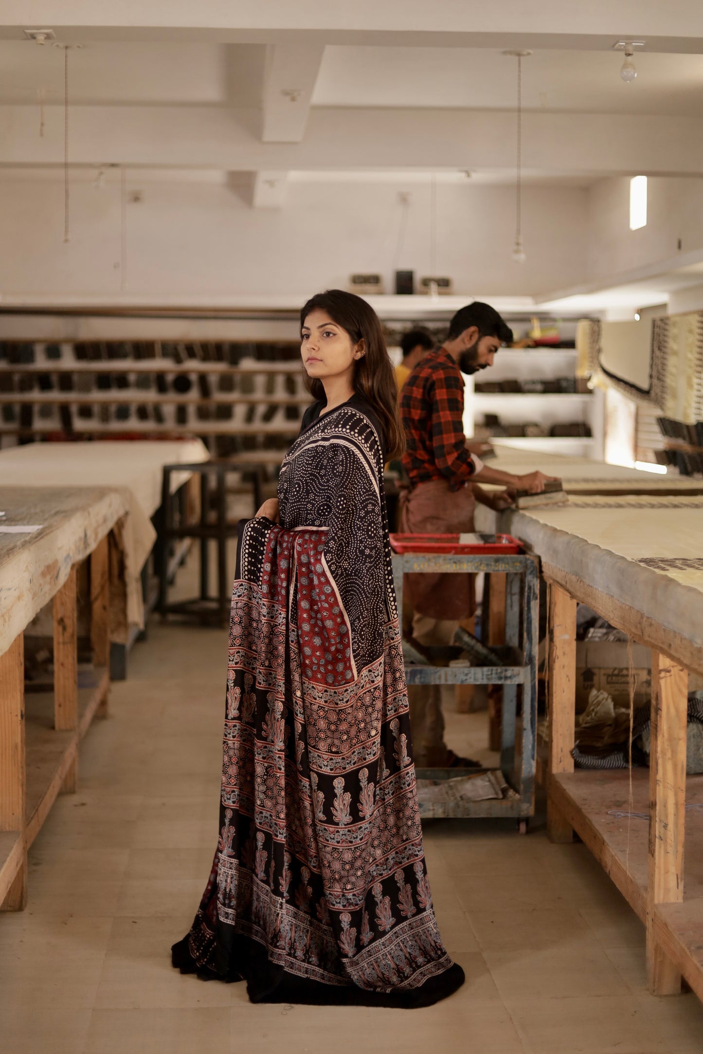 Premium black and maroon modal silk saree showcasing authentic Ajrakh craftsmanship and timeless motifs