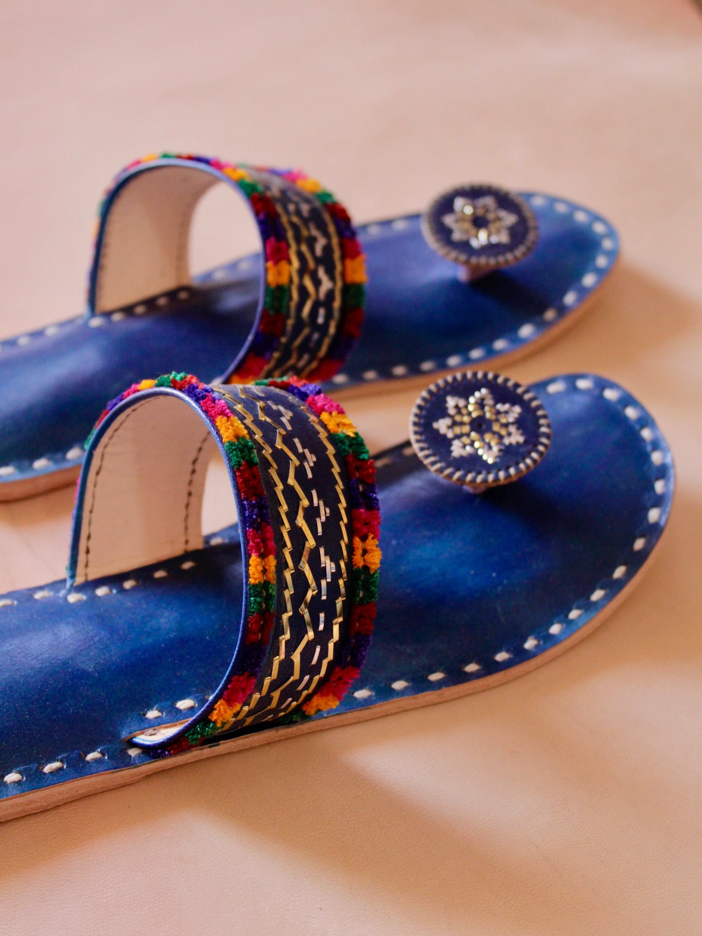Premium blue handcrafted leather flats with fine artisan stitching details