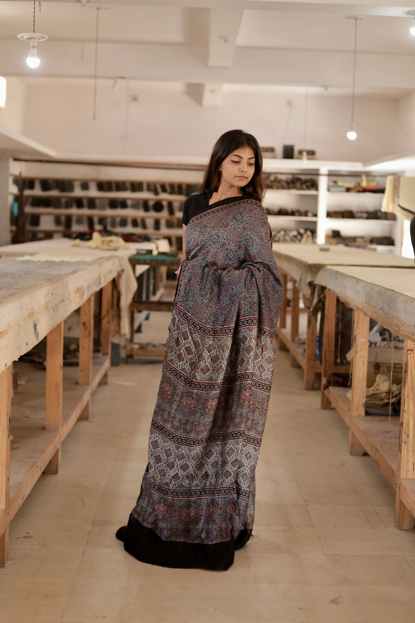 Premium dusty blue modal silk saree showcasing authentic Ajrakh craftsmanship and timeless motifs