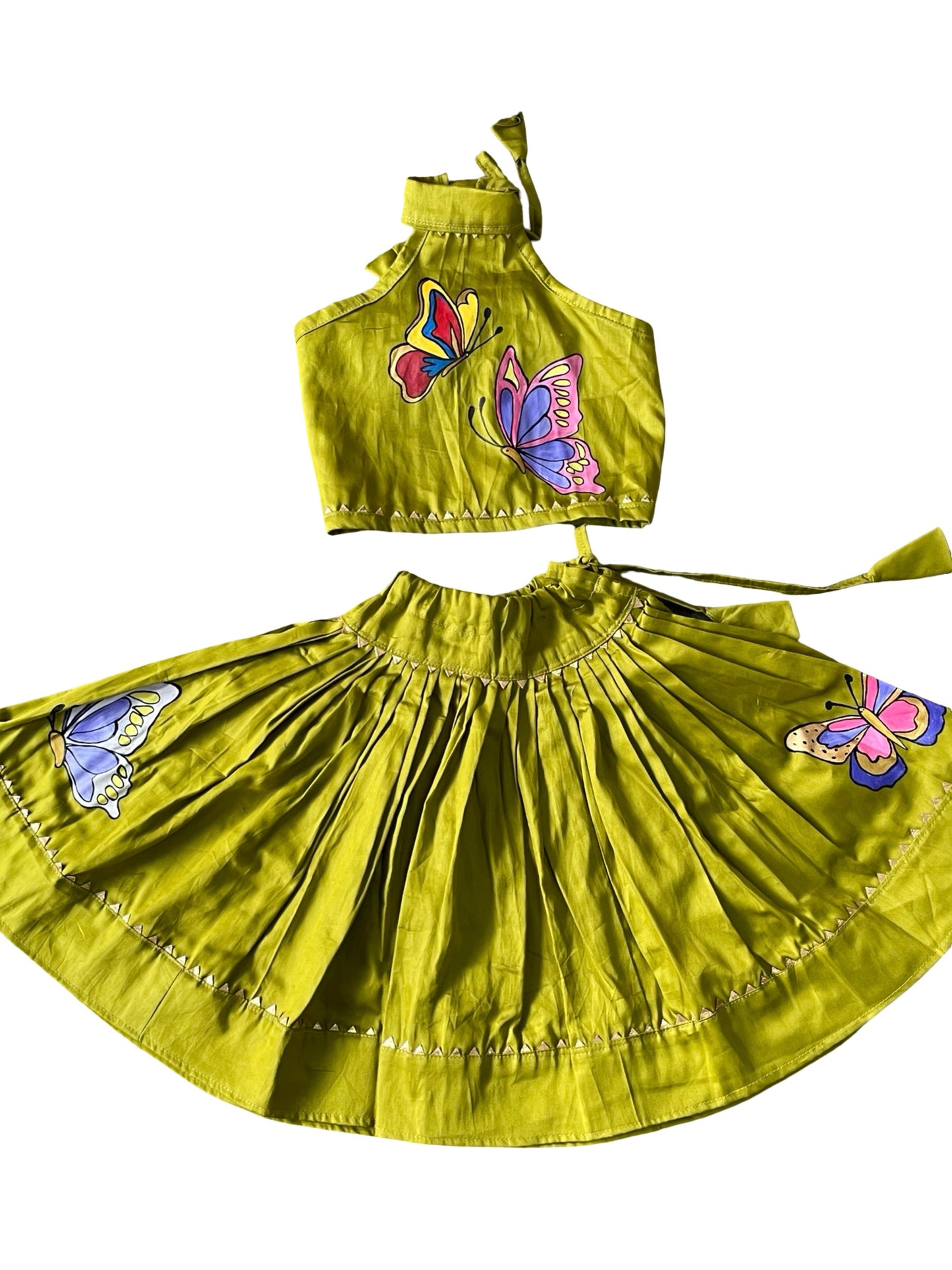 Parrot green handpainted cotton lehenga choli set for kids featuring handcrafted artwork and traditional elegance