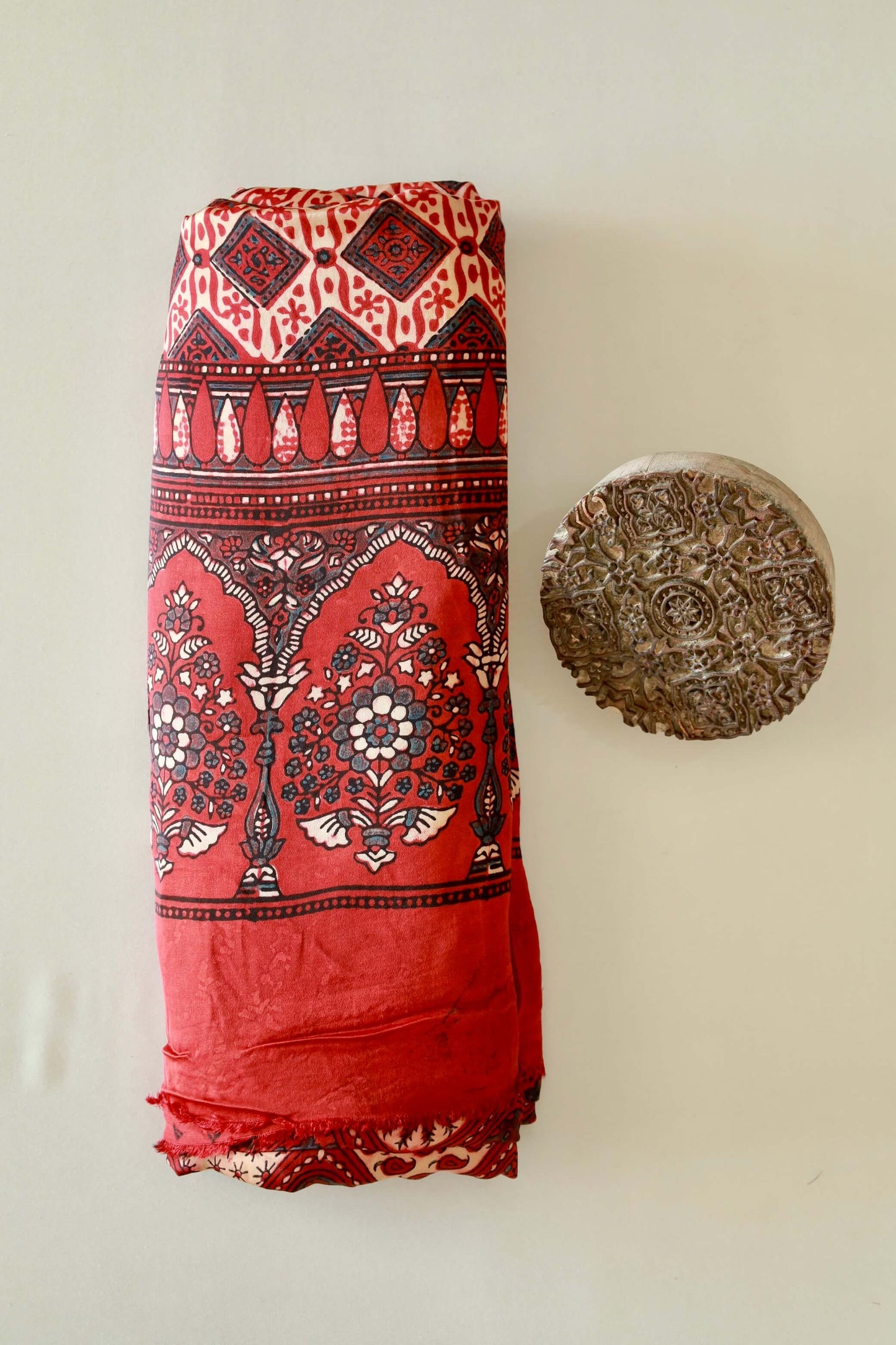 Premium scarlet red modal silk Ajrakh saree with rich heritage-inspired designs and fluid fall