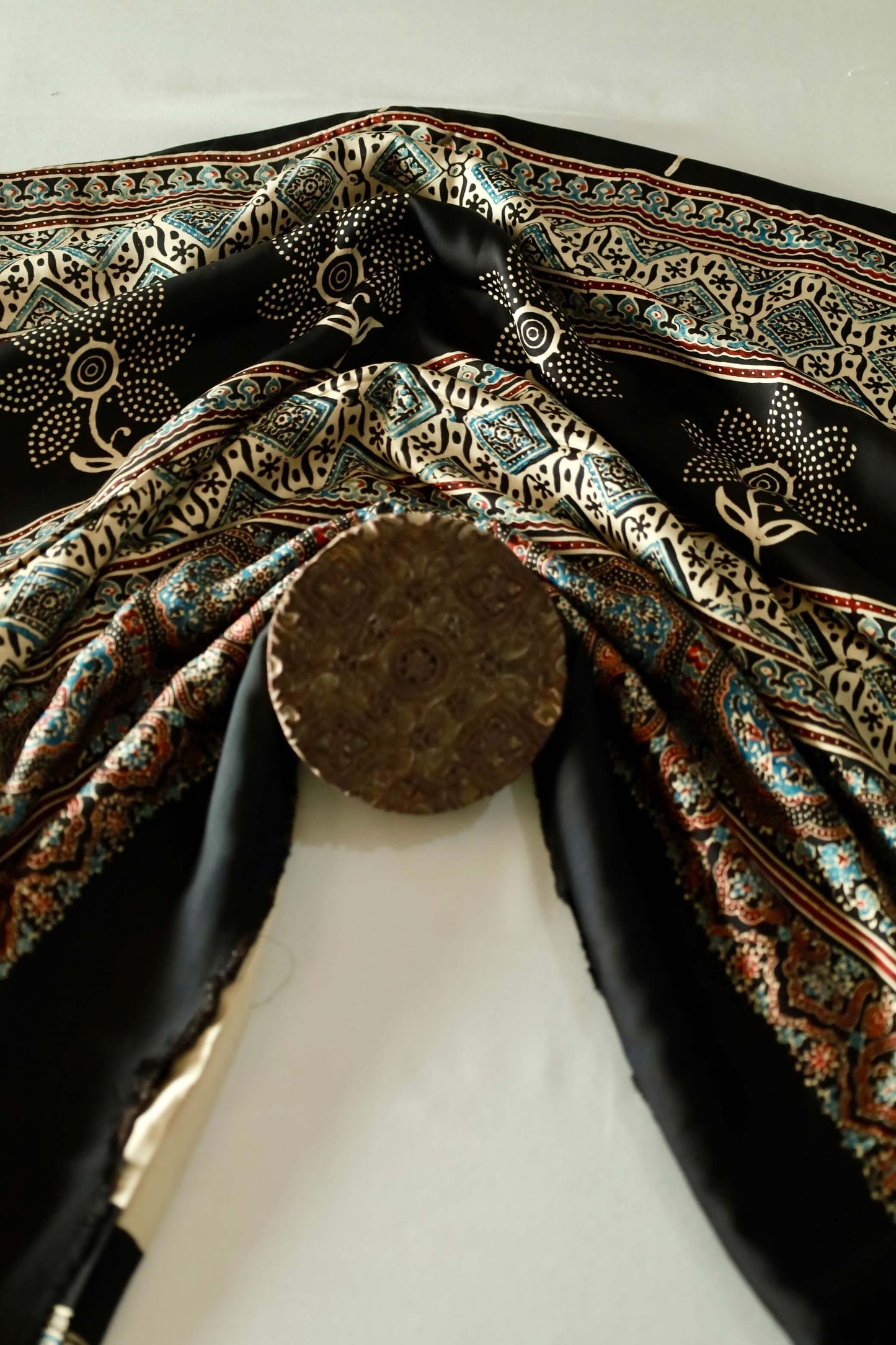 Traditional black sunflower Ajrakh modal silk saree with rich artisanal prints and a soft flowing texture