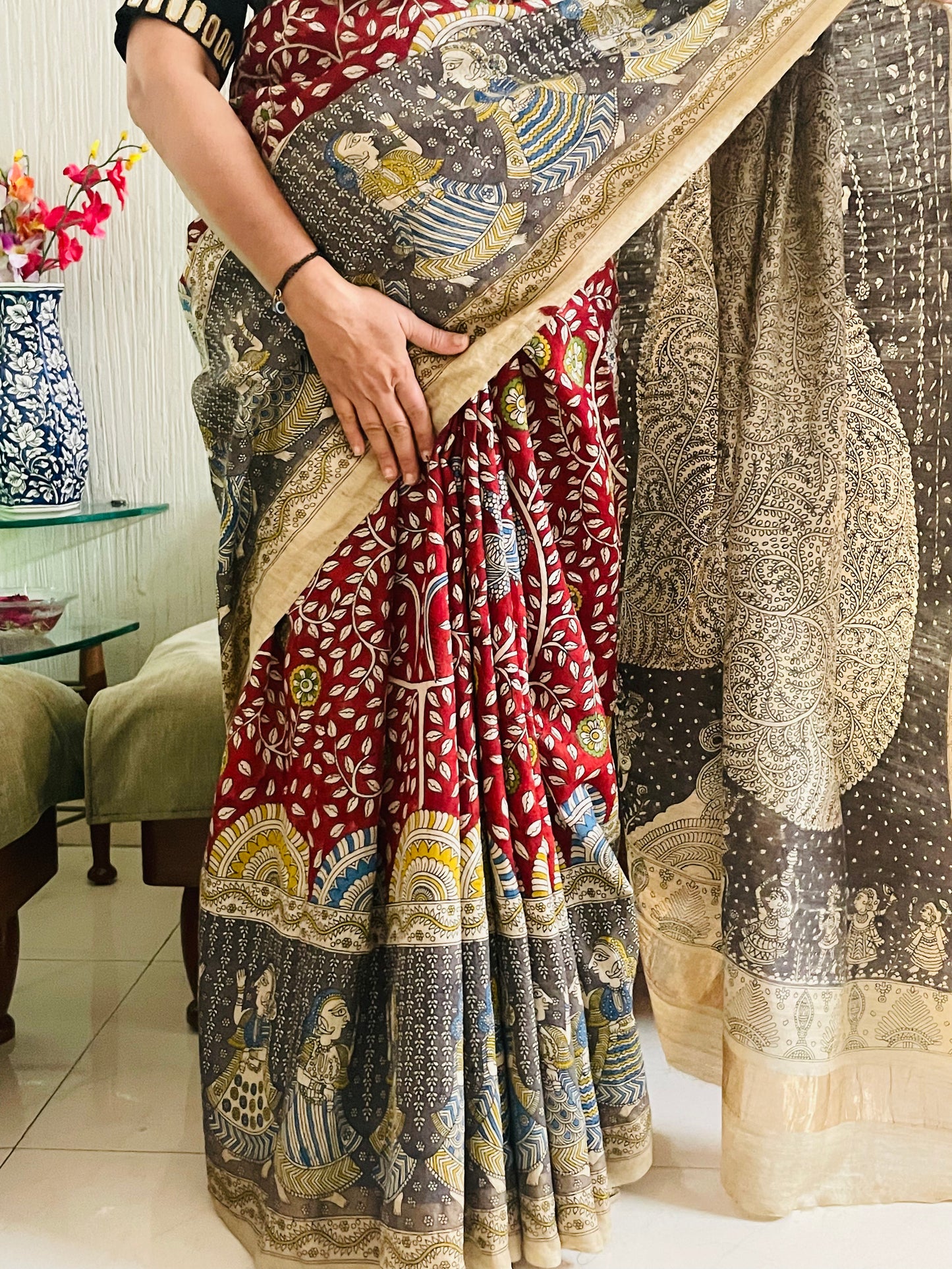 Traditional grey Mata Ni Pachedi saree with vibrant handpainted motifs and graceful artisanal craftsmanship