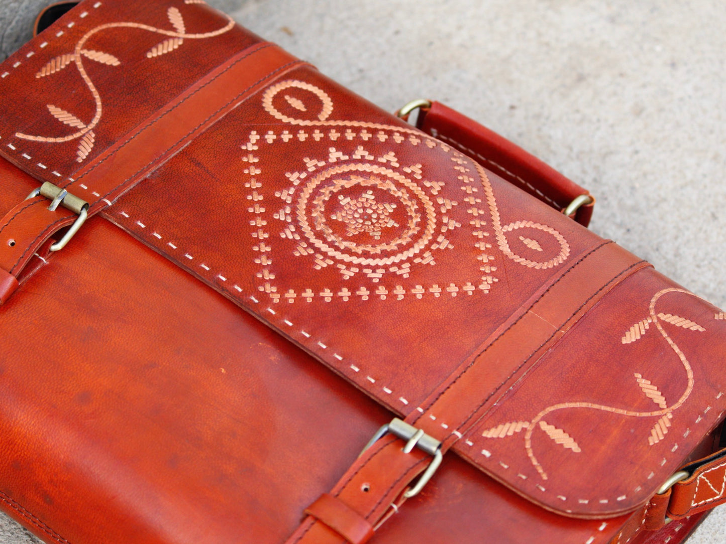 Handcrafted leather office bag showcasing decorative thread work and durable construction