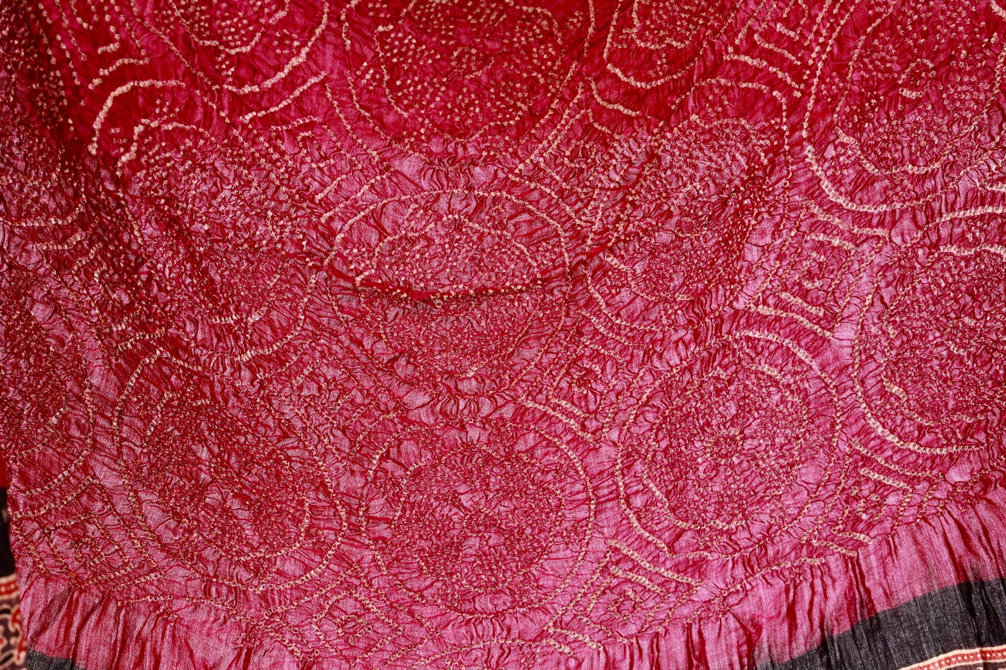 Traditional Ajrakh Bandhani silk saree in maroon hues with rich cultural and artisanal detailing