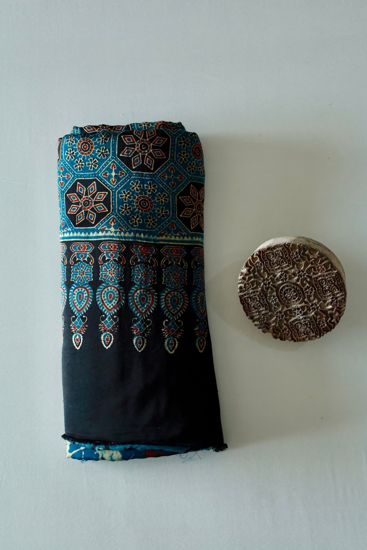 Premium turquoise blue modal silk saree showcasing authentic Ajrakh craftsmanship and timeless motifs