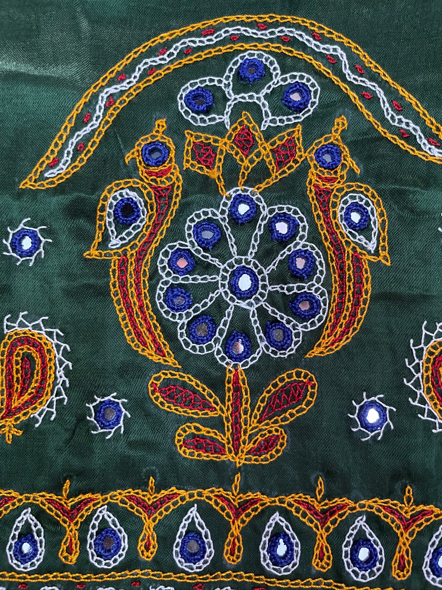 Elegant bottle green blouse piece adorned with beautiful Ahir embroidery motifs