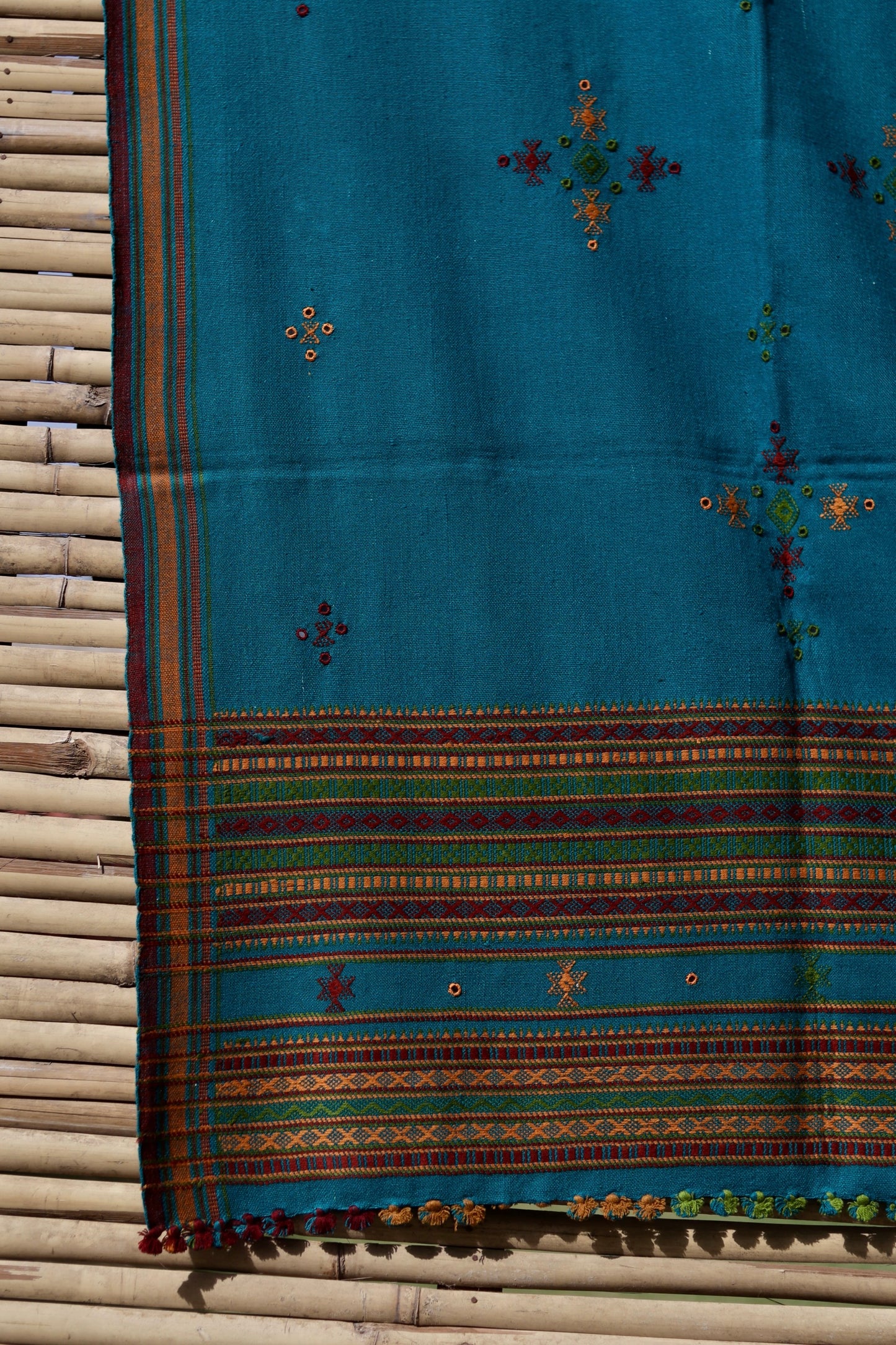 Classic handwoven woolen shawl in turquoise blue designed for warmth, comfort, and sophisticated styling