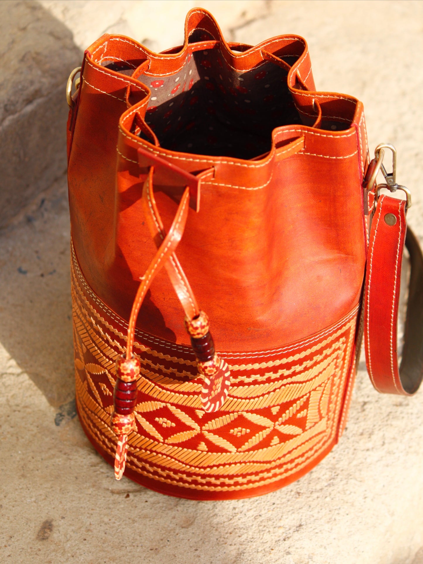 Leather potli bag with thread work