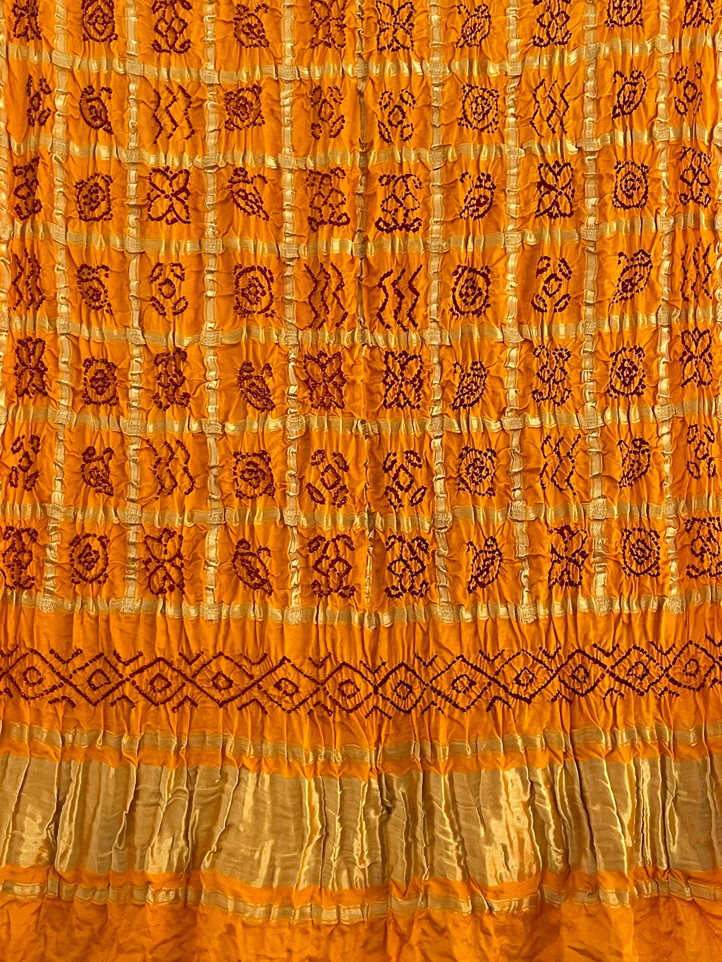 Luxurious mustard yellow Bandhani Gharchola dupatta with rich zari work and festive appeal