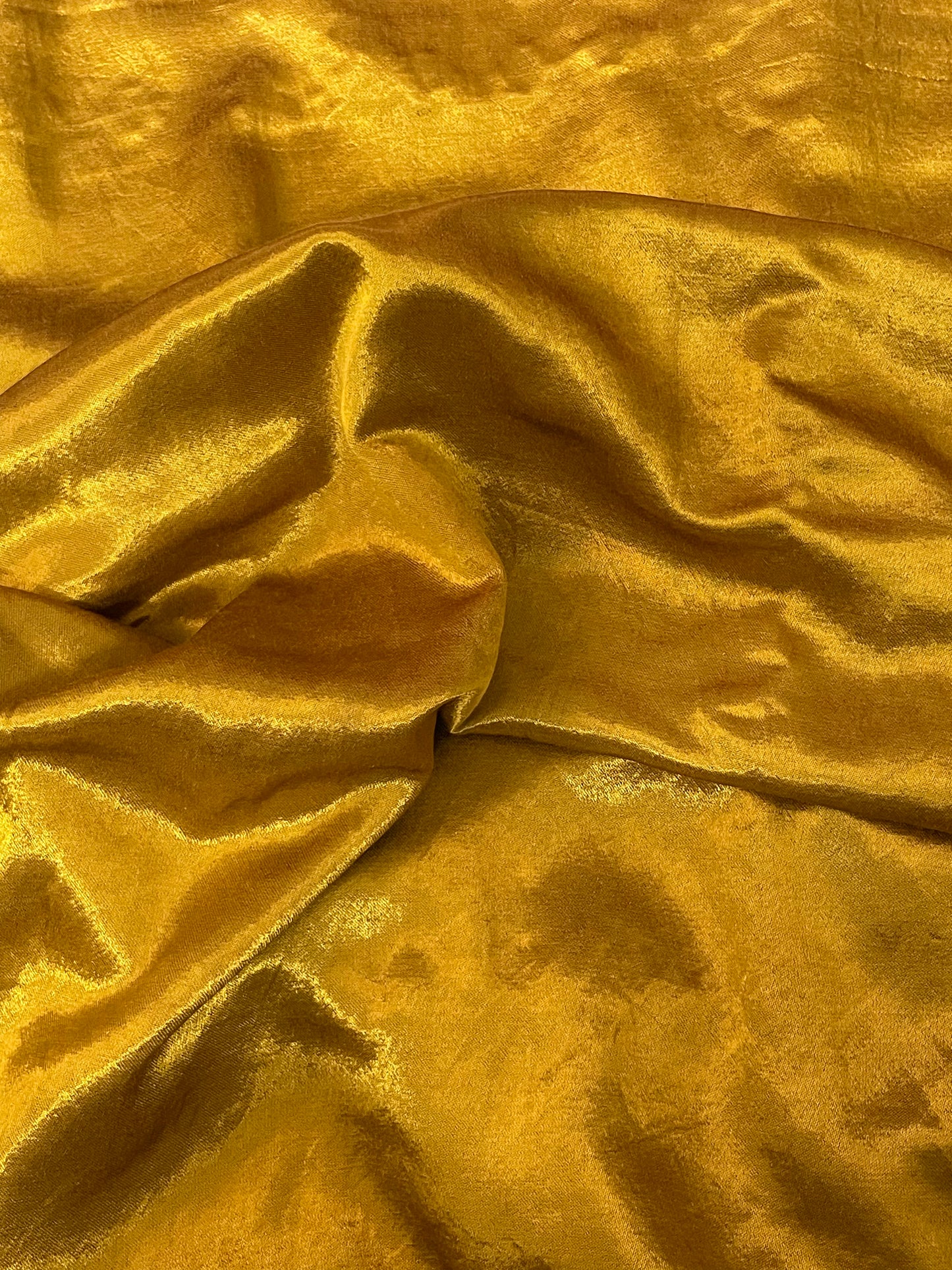 Premium antique gold ethnic dress material adorned with decorative mirror accents