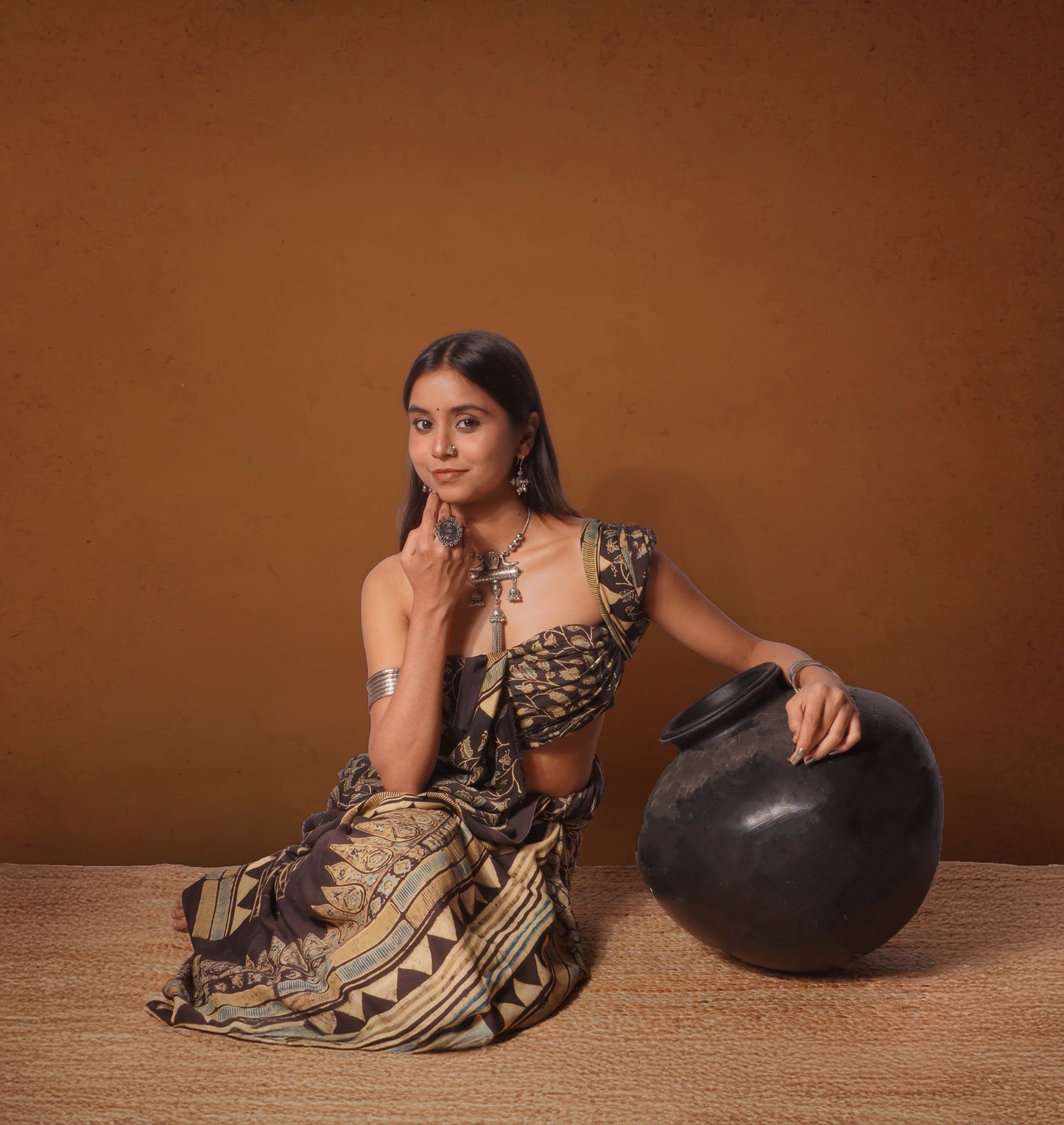 Premium chocolate brown modal silk saree showcasing authentic Ajrakh craftsmanship and timeless motifs