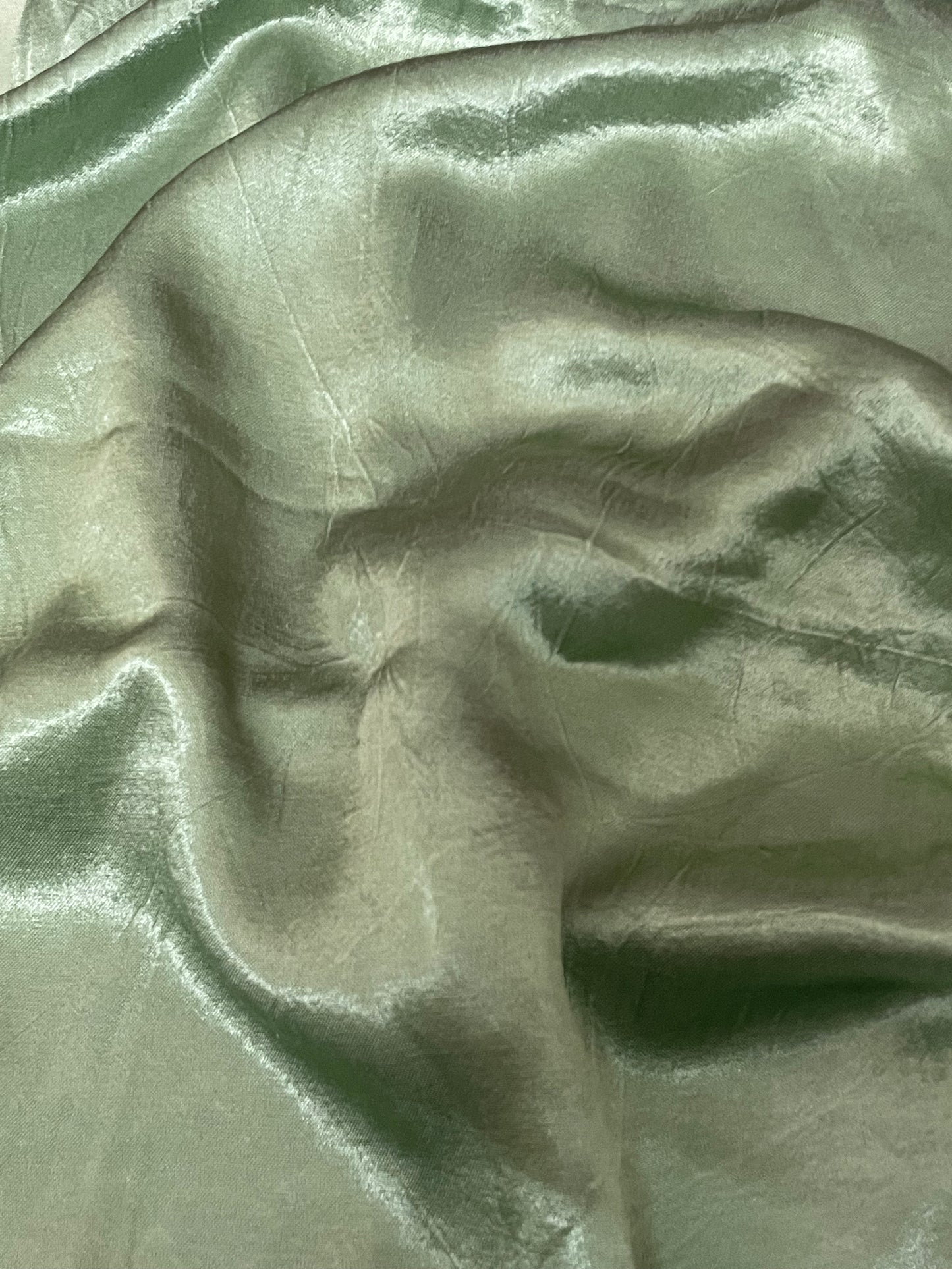 Premium soft green ethnic dress material adorned with decorative mirror accents