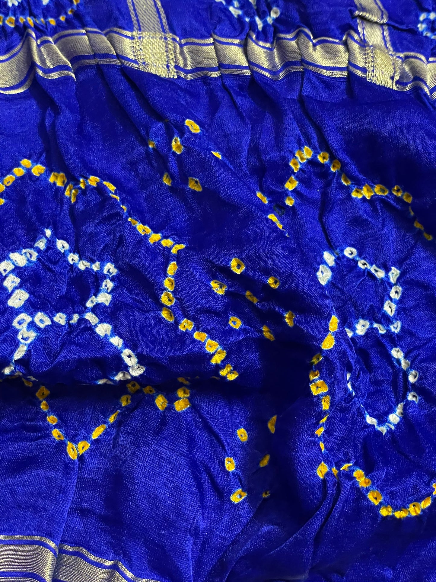Luxurious sapphire blue Bandhani Gharchola dupatta with rich zari work and festive appeal