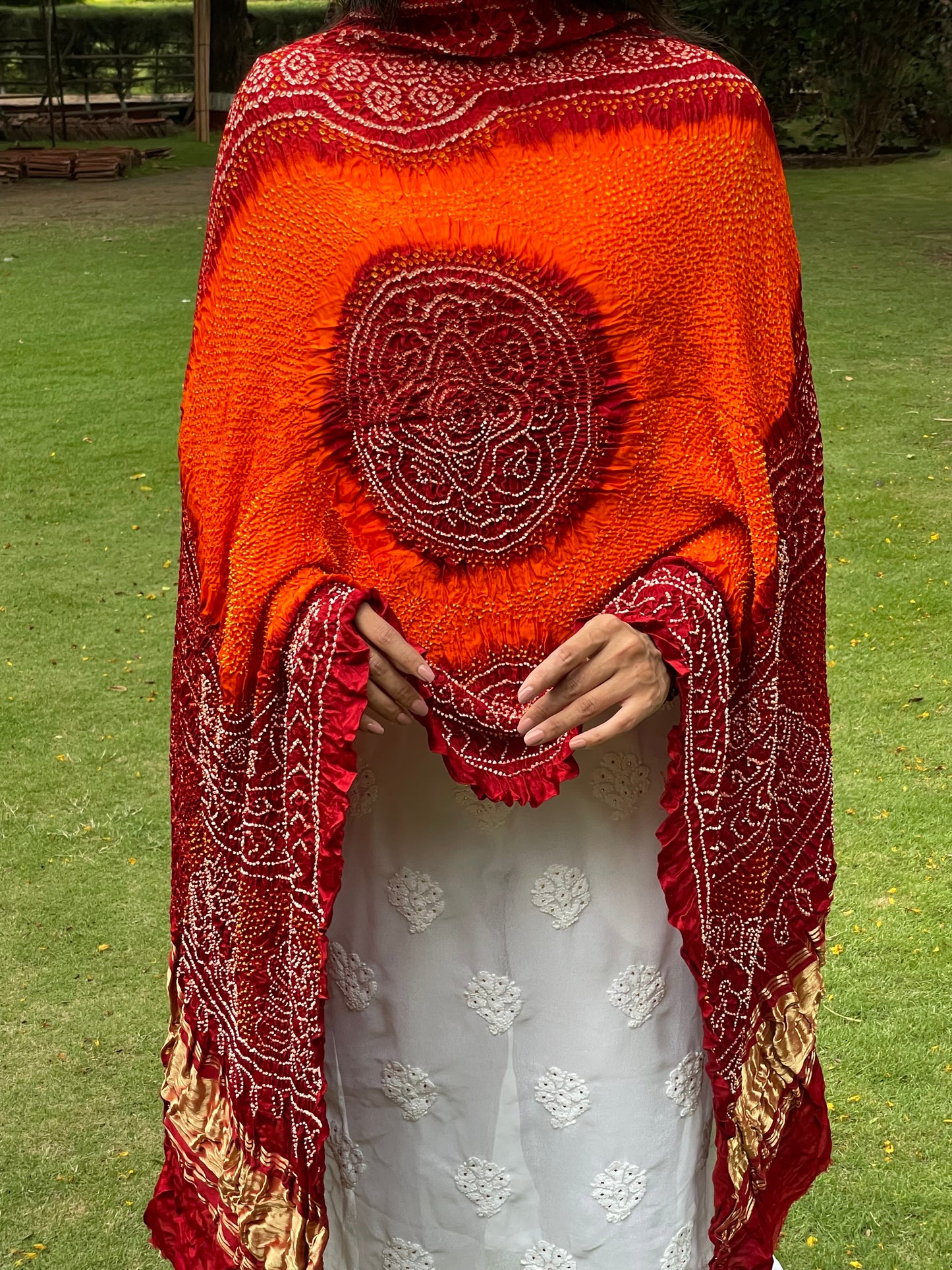 Premium Gajji silk Bandhani dupatta in rich tangerine and red colors for festive wear