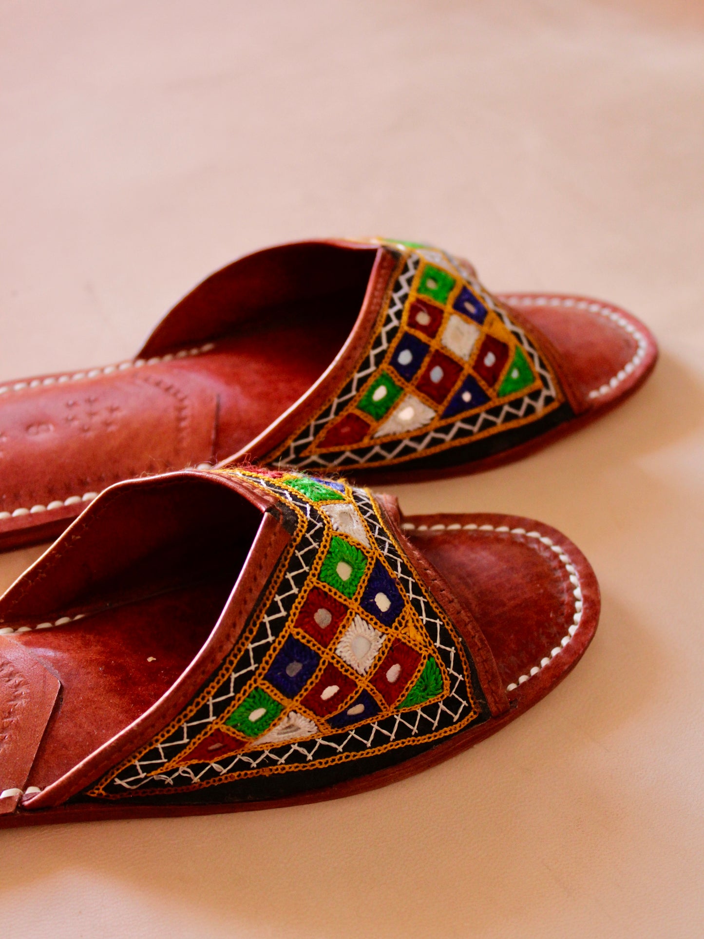Premium embroidered leather flats handcrafted with fine artisan stitching