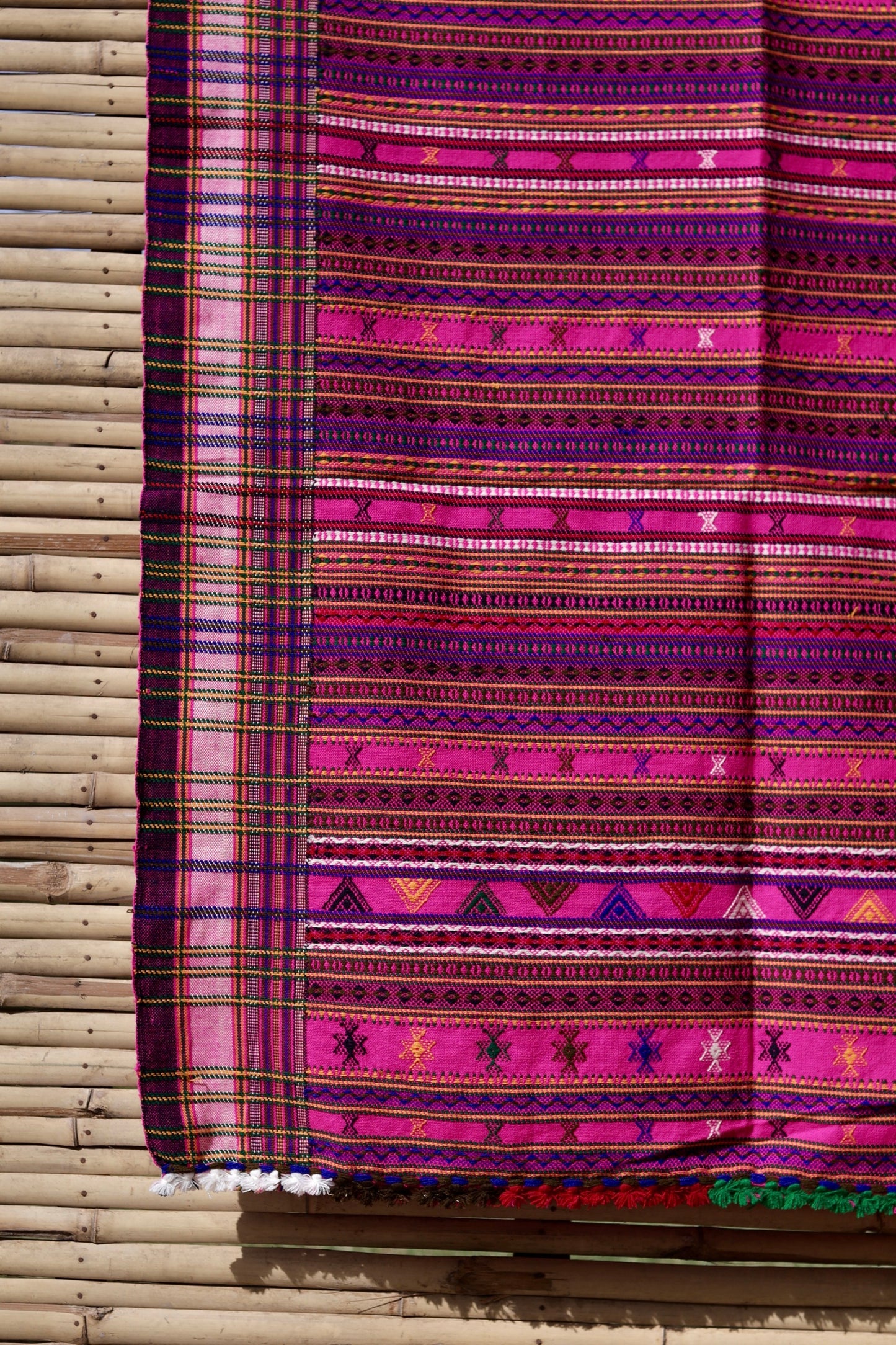 Premium handwoven woolen shawl in fuchsia with a soft texture and graceful drape
