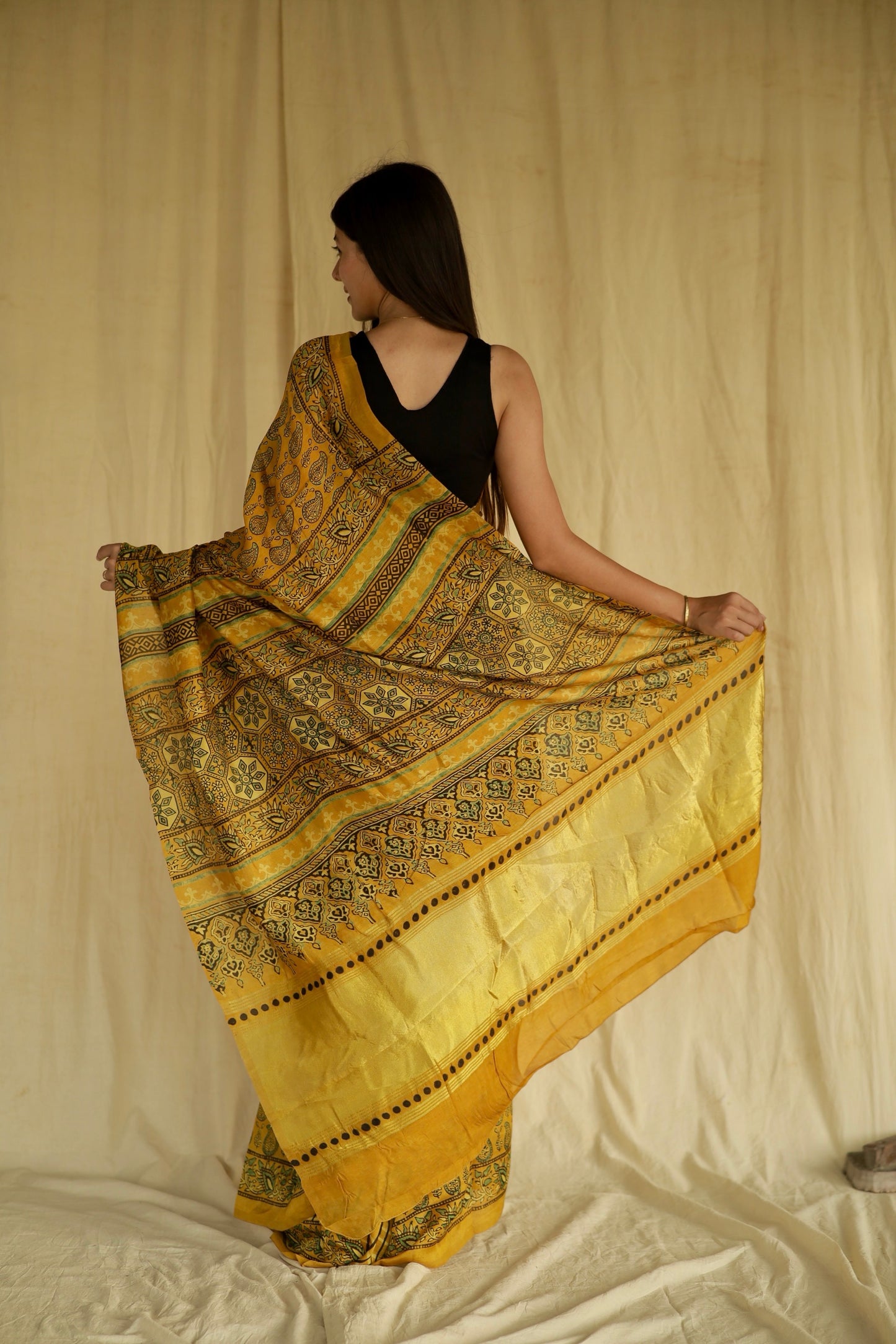 Premium olive gold Chanderi silk saree with heritage-inspired Ajrakh designs and subtle sheen
