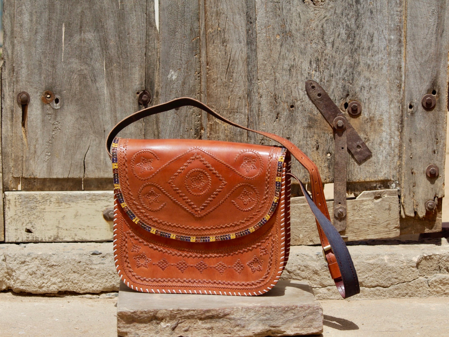 Artisan-crafted leather bag featuring traditional hand stitching and durable construction
