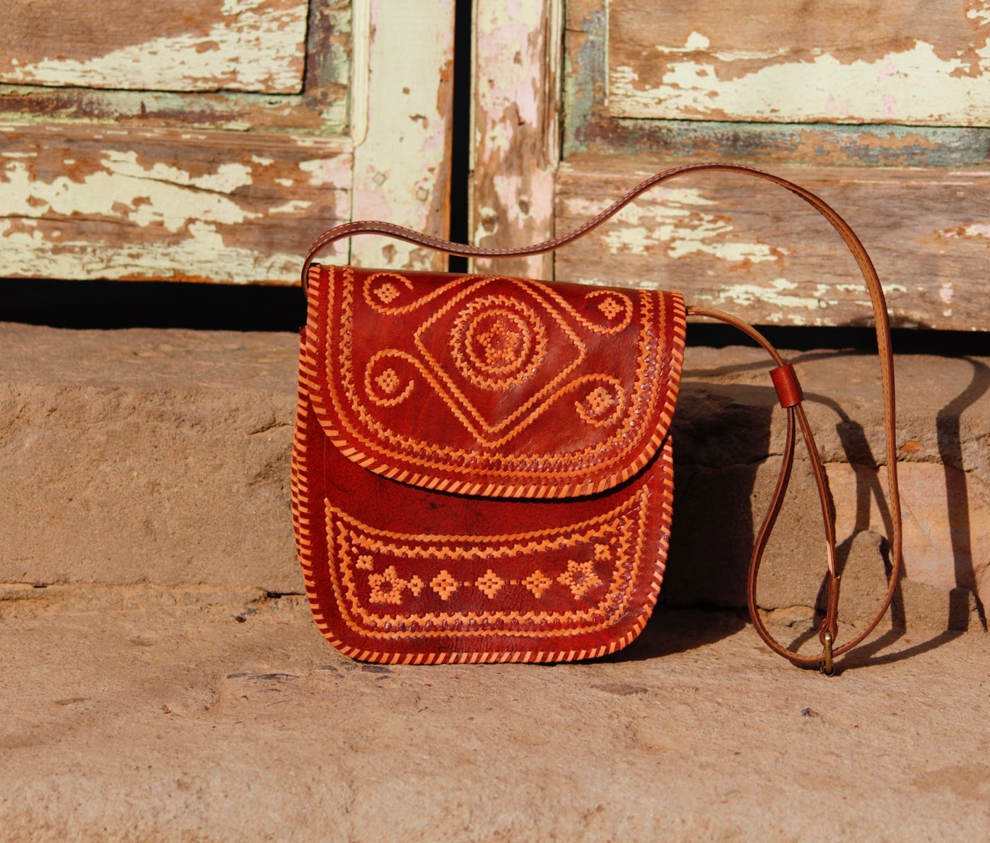 Leather bag featuring intricate thread work on premium handcrafted leather