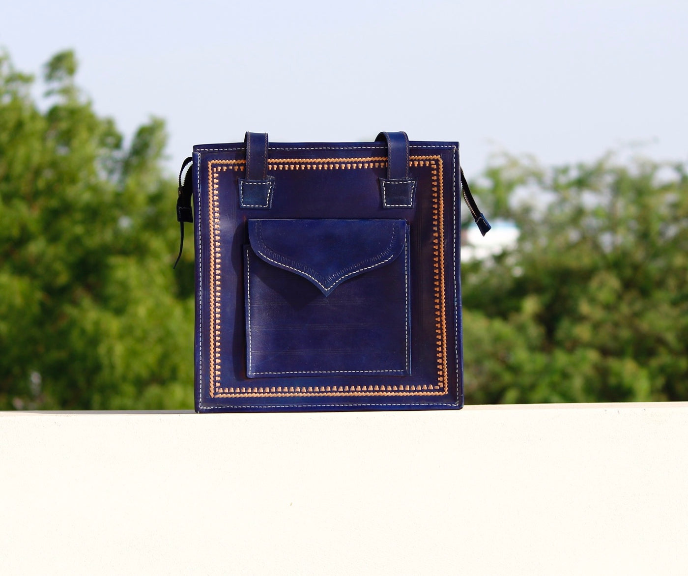 Handstitched leather bag crafted from premium leather with meticulous handmade detailing