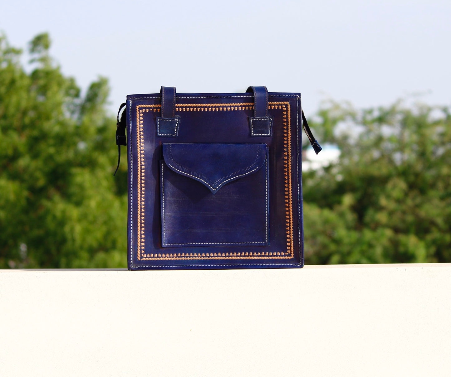 Handstitched leather bag crafted from premium leather with meticulous handmade detailing