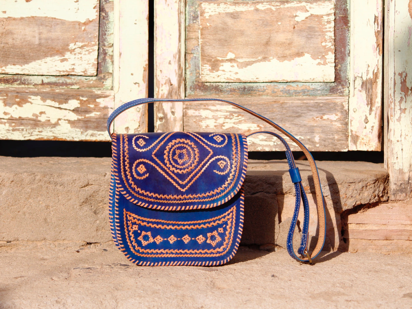 Elegant leather bag with embroidered accents and durable leather construction