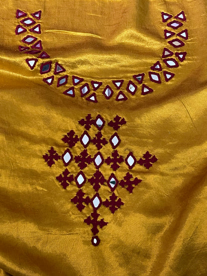 Antique gold mirror work dress material showcasing intricate handcrafted embellishments