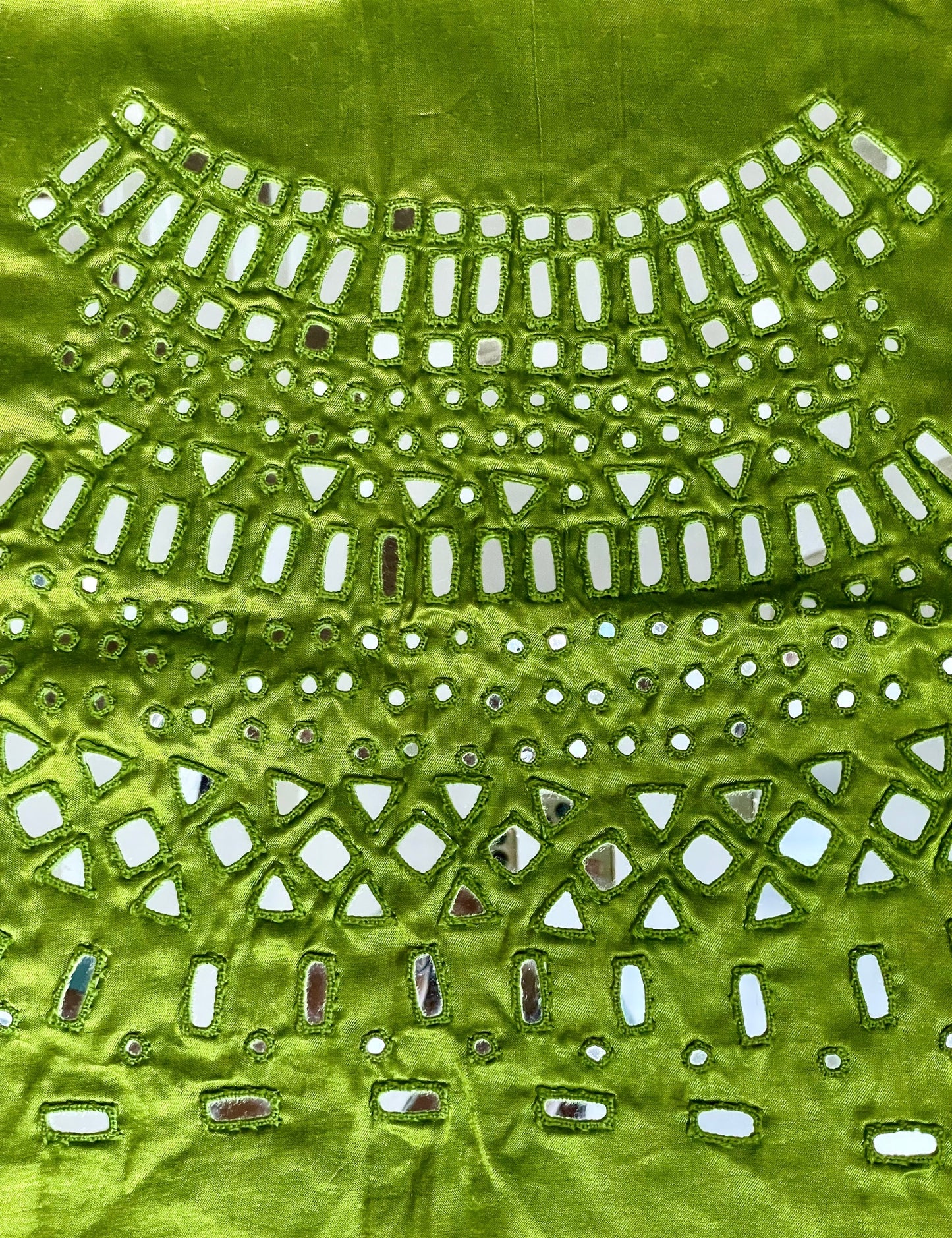 Apple green mirror work blouse piece showcasing intricate handcrafted embellishments