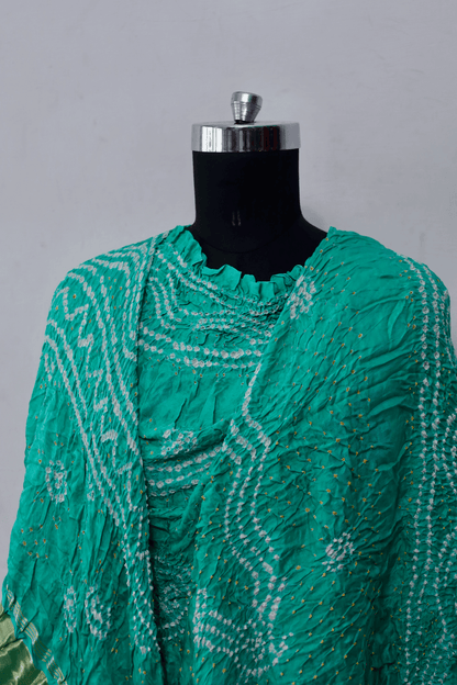 Ethnic aqua mint Gajji silk dupatta showcasing authentic Bandhani artistry
Luxurious aqua mint Bandhani dupatta crafted in soft and lustrous 