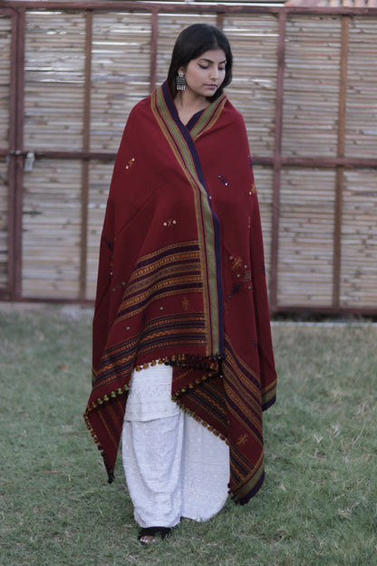Elegant burgundy wool shawl handcrafted using traditional handloom weaving techniques