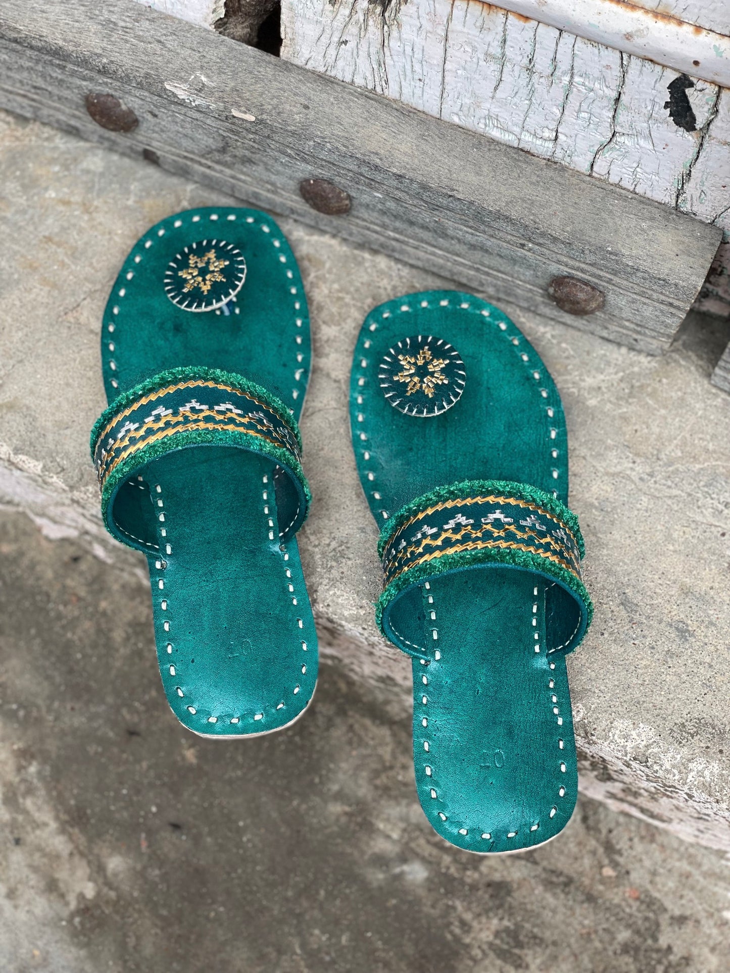 Cyan handstitched leather flats showcasing traditional craftsmanship and comfortable design