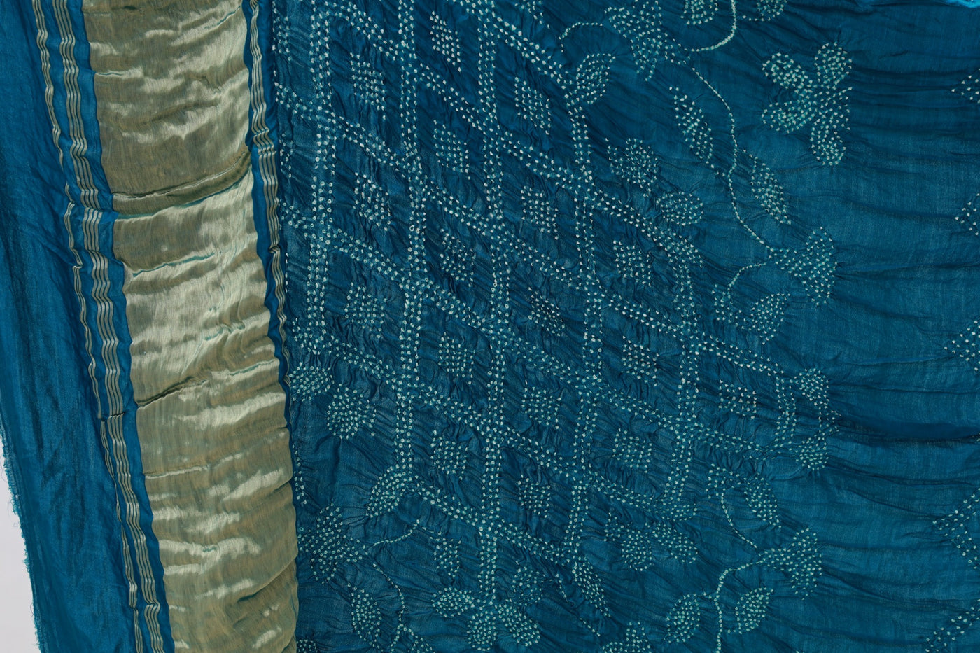 Deep sea Rai Bandhani silk saree featuring intricate tie-dye patterns and an elegant zari pallu