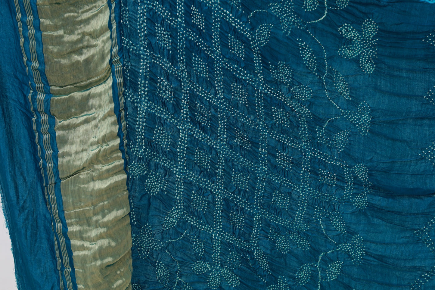 Deep sea Rai Bandhani silk saree featuring intricate tie-dye patterns and an elegant zari pallu