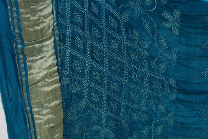 Deep sea Rai Bandhani silk saree featuring intricate tie-dye patterns and an elegant zari pallu