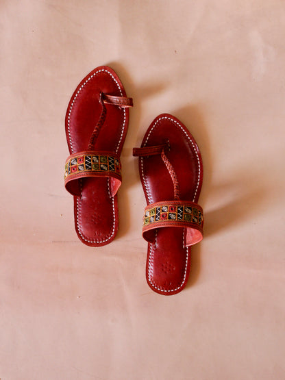 Embroidery handstitched leather chappal showcasing traditional craftsmanship and intricate detailing