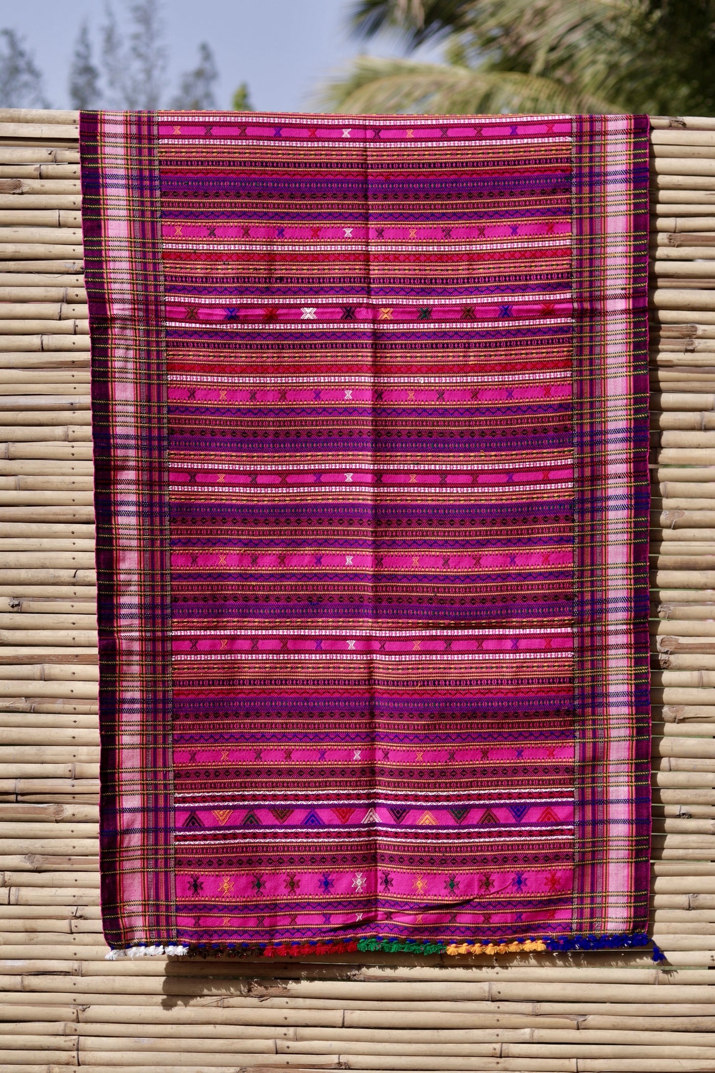 Elegant fuchsia wool shawl handcrafted using traditional handloom weaving techniques