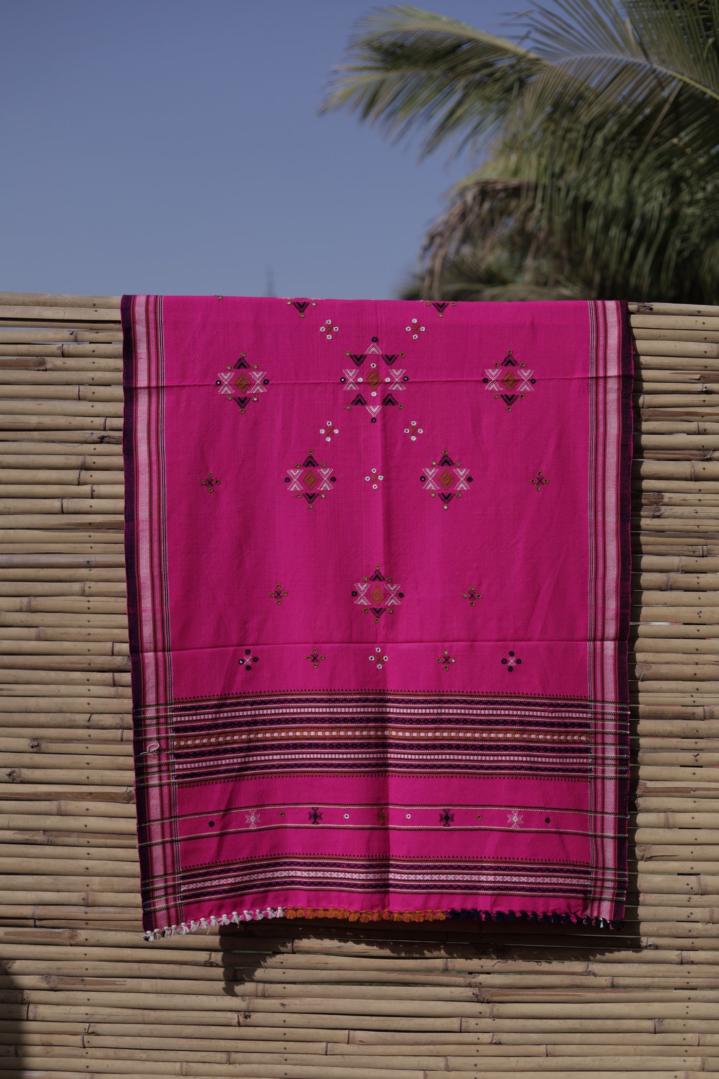 Elegant fuchsia pink wool shawl handcrafted using traditional handloom weaving techniques