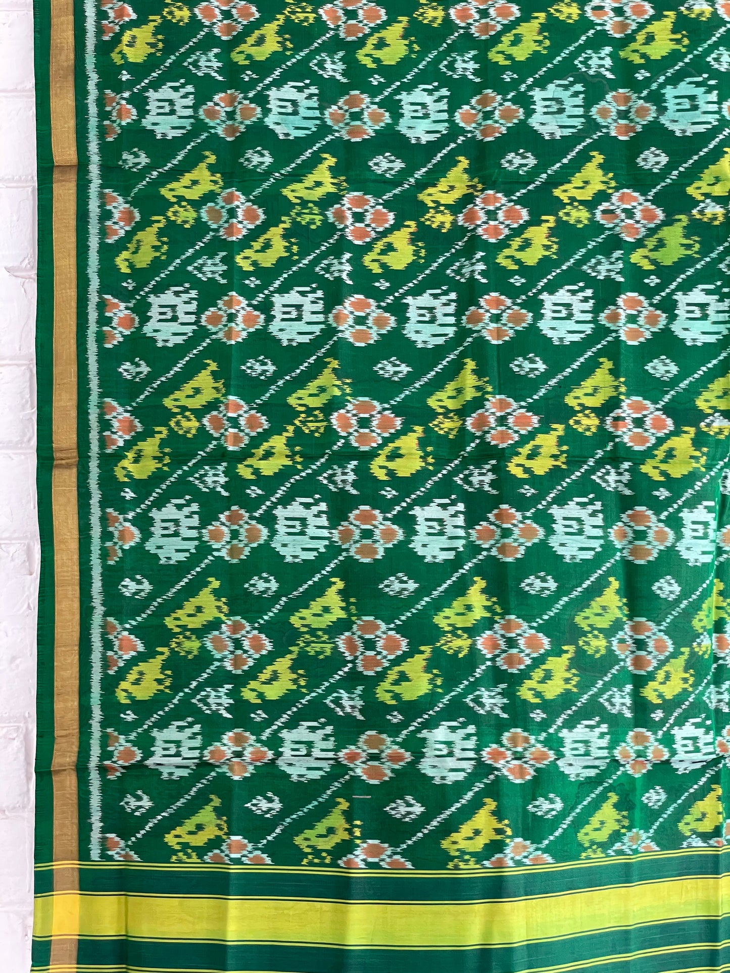 Green Patola Single Ikkat dupatta featuring intricate woven motifs and traditional artisan craftsmanship