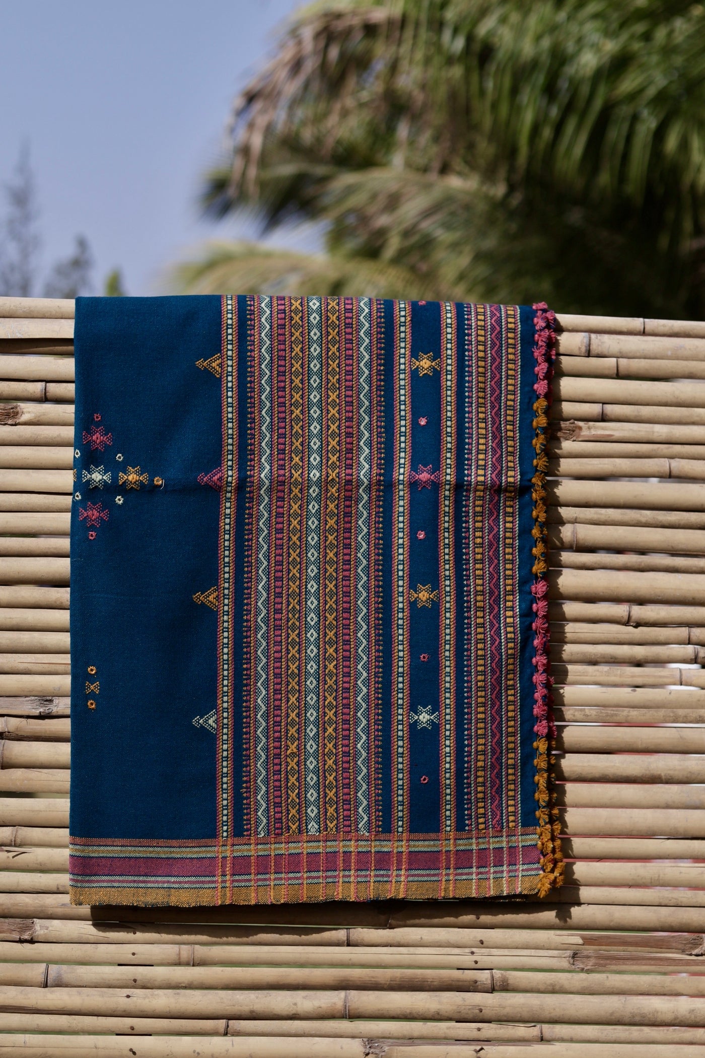 Elegant indigo blue wool shawl handcrafted using traditional handloom weaving techniques