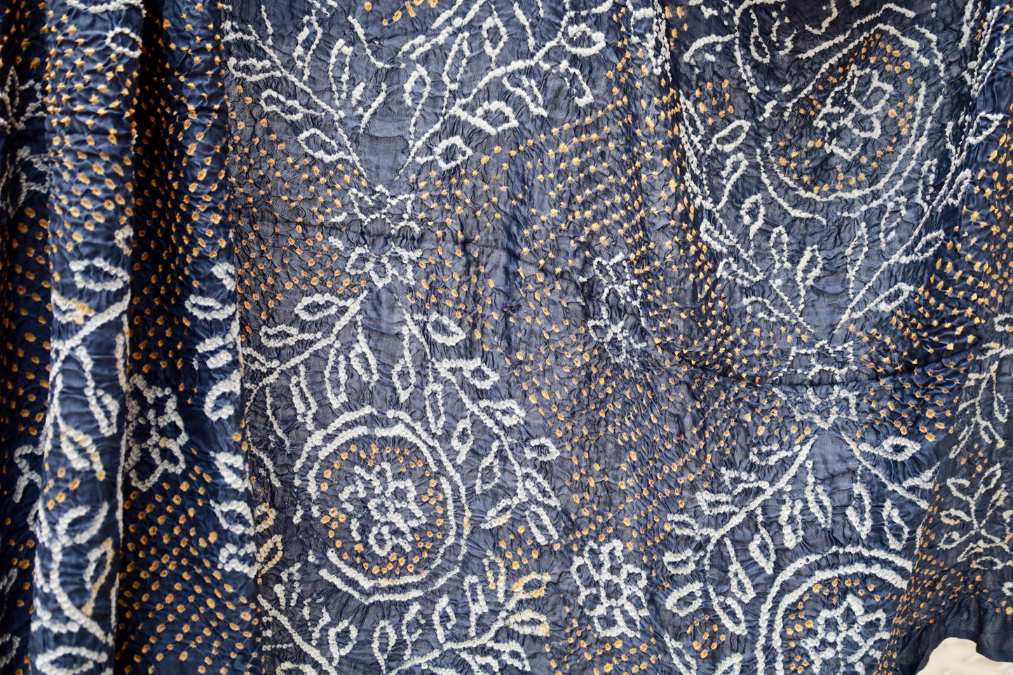 Indigo Rai Bandhani silk saree featuring intricate tie-dye patterns and an elegant zari pallu