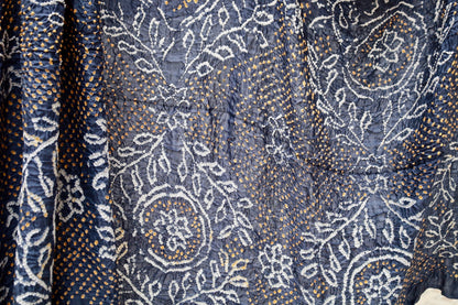 Indigo Rai Bandhani silk saree featuring intricate tie-dye patterns and an elegant zari pallu