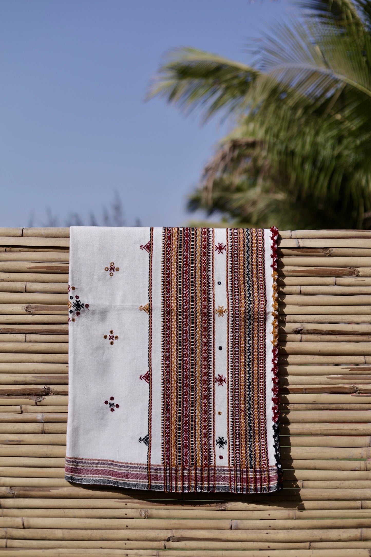 Elegant ivory white wool shawl handcrafted using traditional handloom weaving techniques