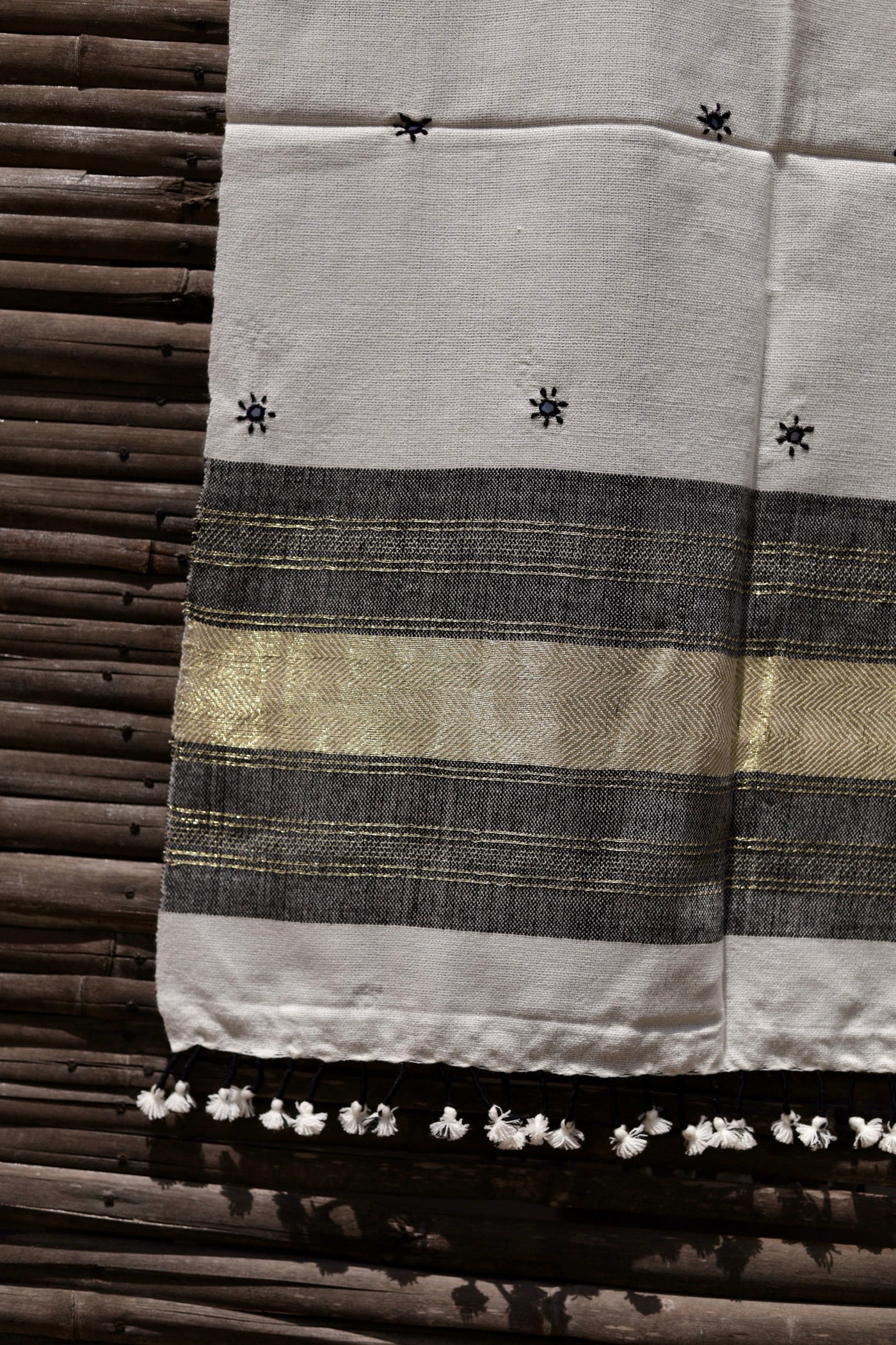 Elegant pearl white wool stole handcrafted using traditional handloom weaving techniques